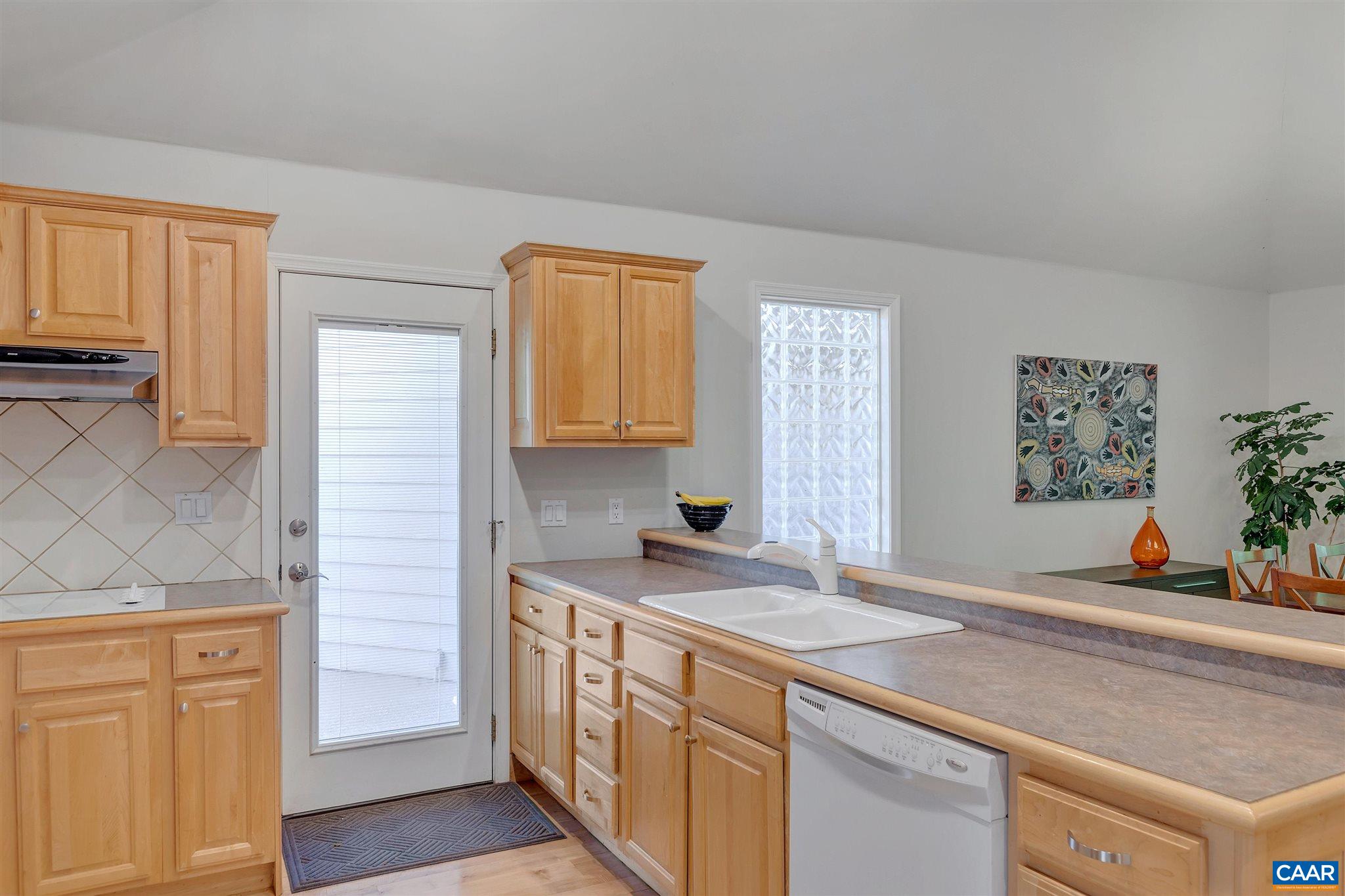 292 Blackthorn Lane Charlottesville, VA 22902 - Photo 18 of 64 a kitchen with stainless steel appliances granite countertop a sink stove and cabinets