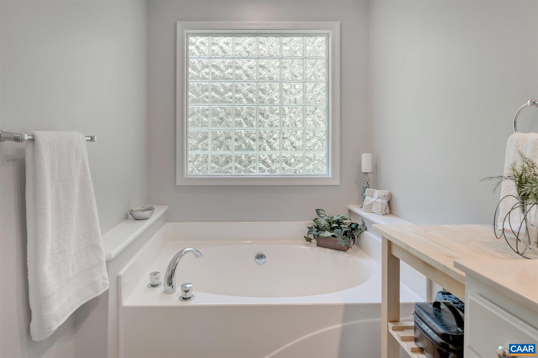 292 Blackthorn Lane Charlottesville, VA 22902 - Photo 27 of 64 a white bath tub sitting next to a white sink