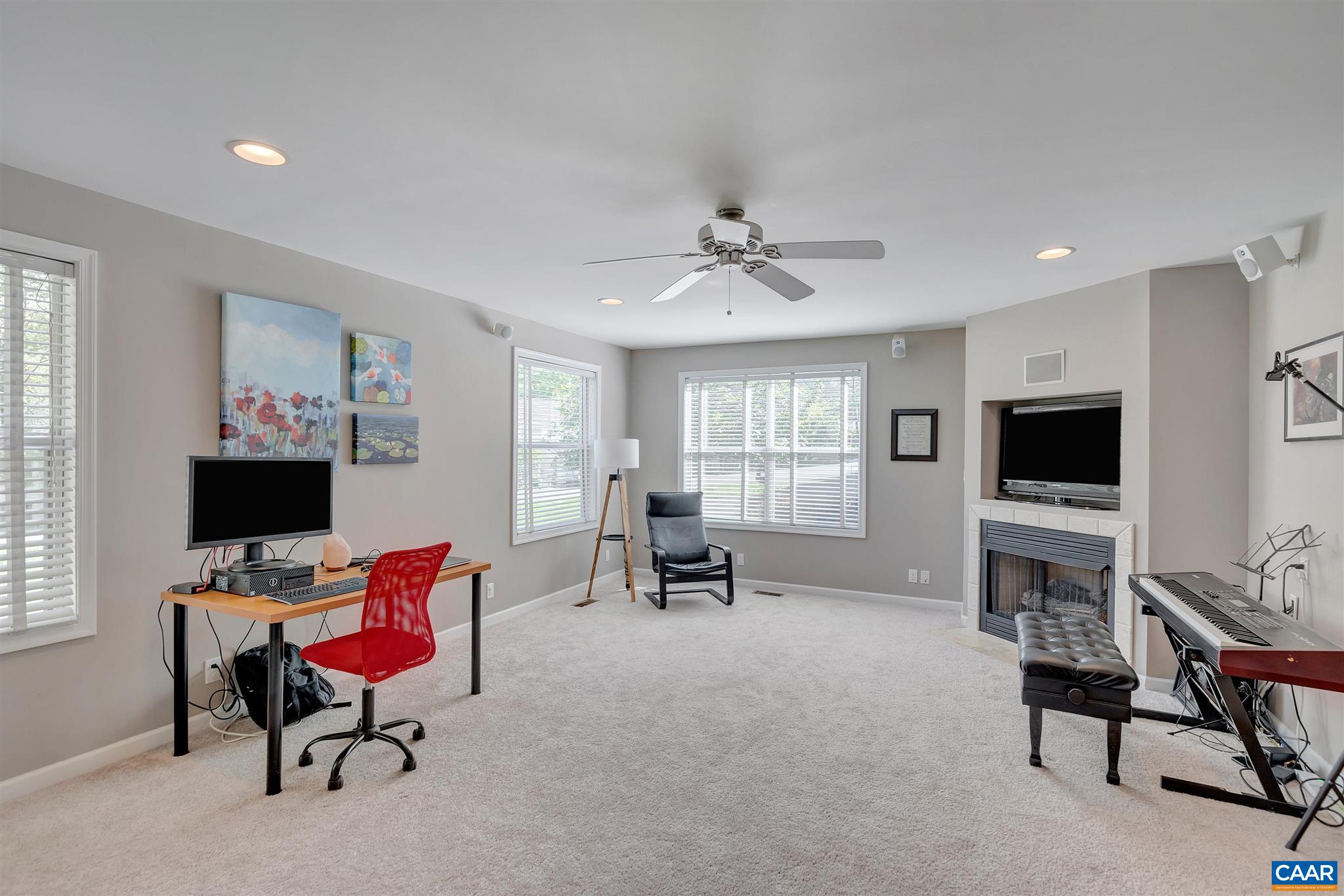 292 Blackthorn Lane Charlottesville, VA 22902 - Photo 37 of 64 a living room with furniture and a flat screen tv