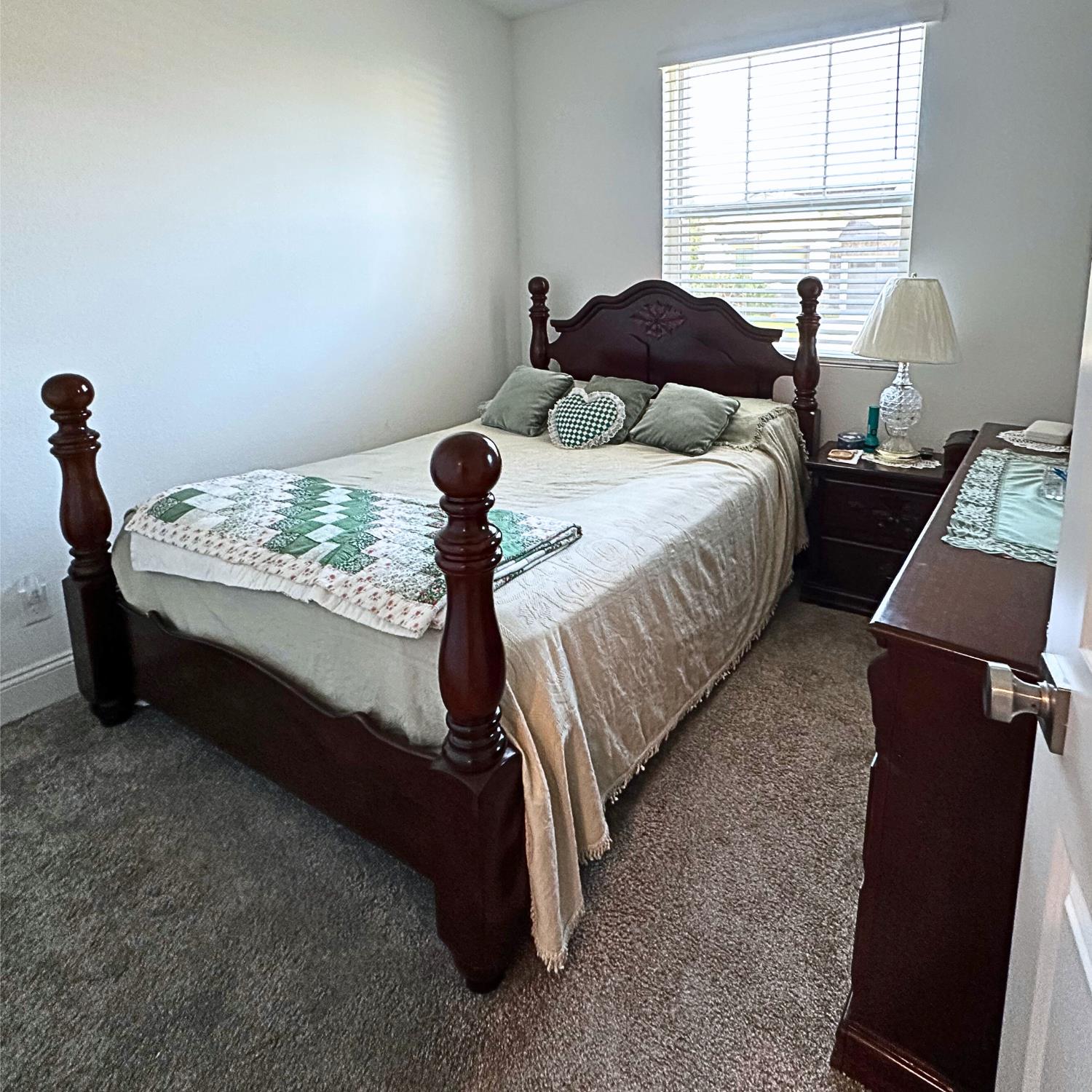 10113 Wayfaring Drive Stockton, CA 95219 - Photo 15 of 26 a bed sitting in a bedroom next to a window