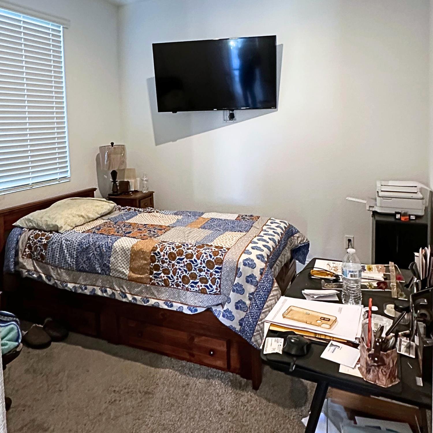 10113 Wayfaring Drive Stockton, CA 95219 - Photo 16 of 26 a bedroom with a bed and a flat screen tv