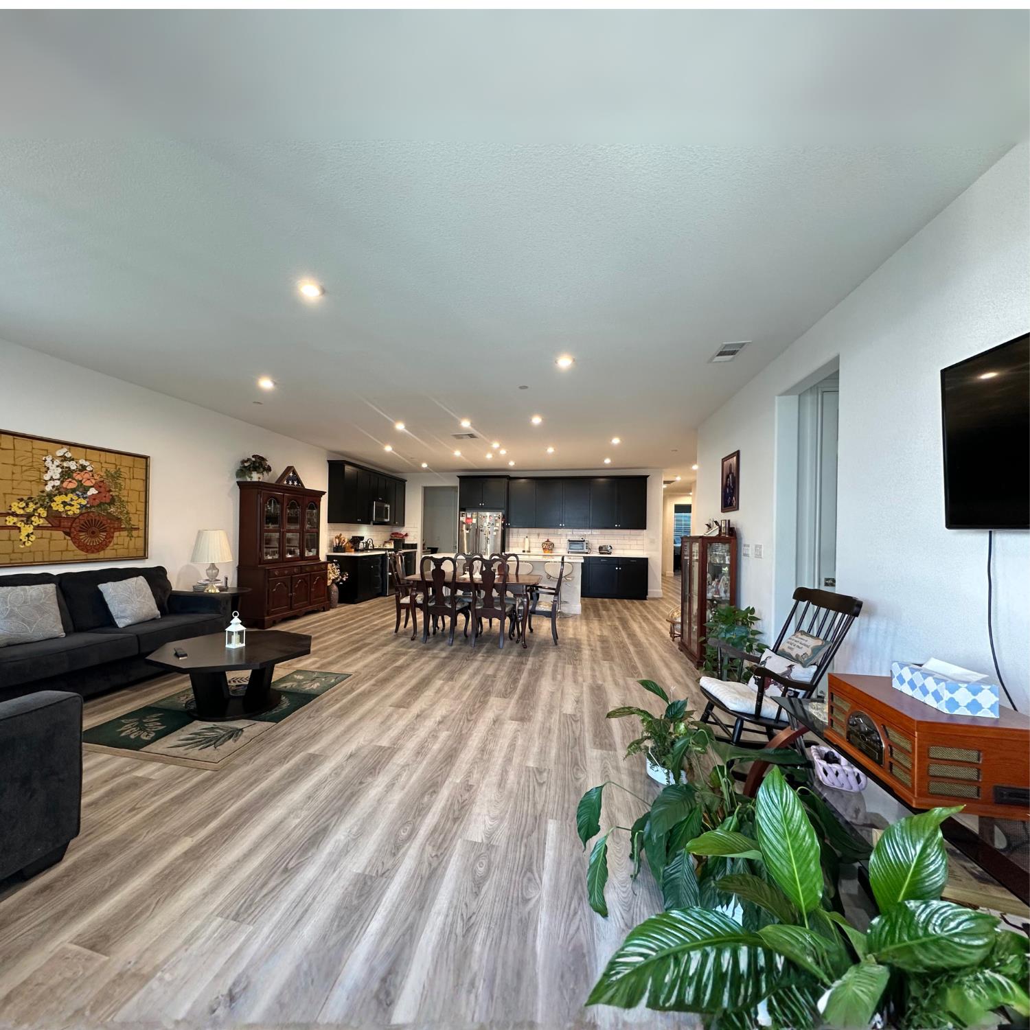 10113 Wayfaring Drive Stockton, CA 95219 - Photo 6 of 26 a living room with furniture and a flat screen tv