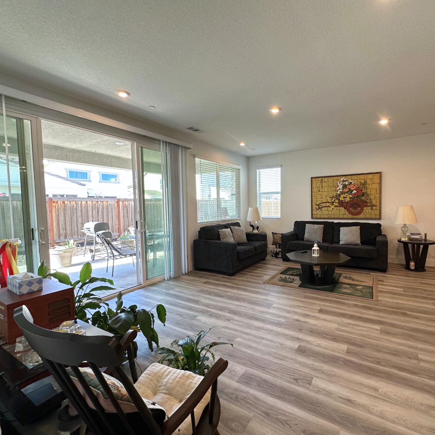 10113 Wayfaring Drive Stockton, CA 95219 - Photo 7 of 26 a living room with furniture and a wooden floor