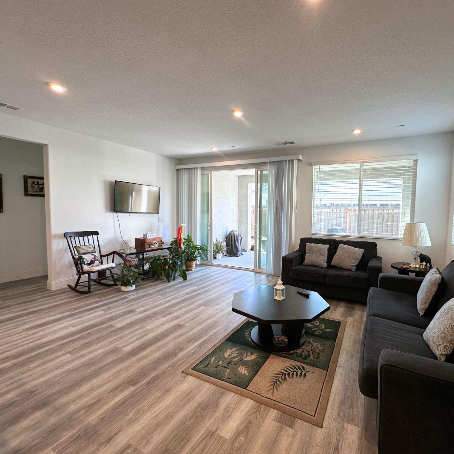 10113 Wayfaring Drive Stockton, CA 95219 - Photo 8 of 26 a living room with furniture and a wooden floor