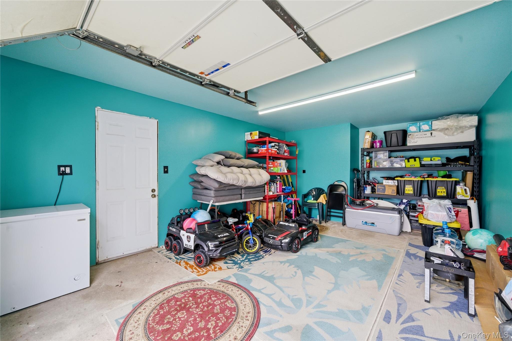 50 Ridge Lane Levittown, NY 11756 - Photo 21 of 27 a view of a garage with furniture