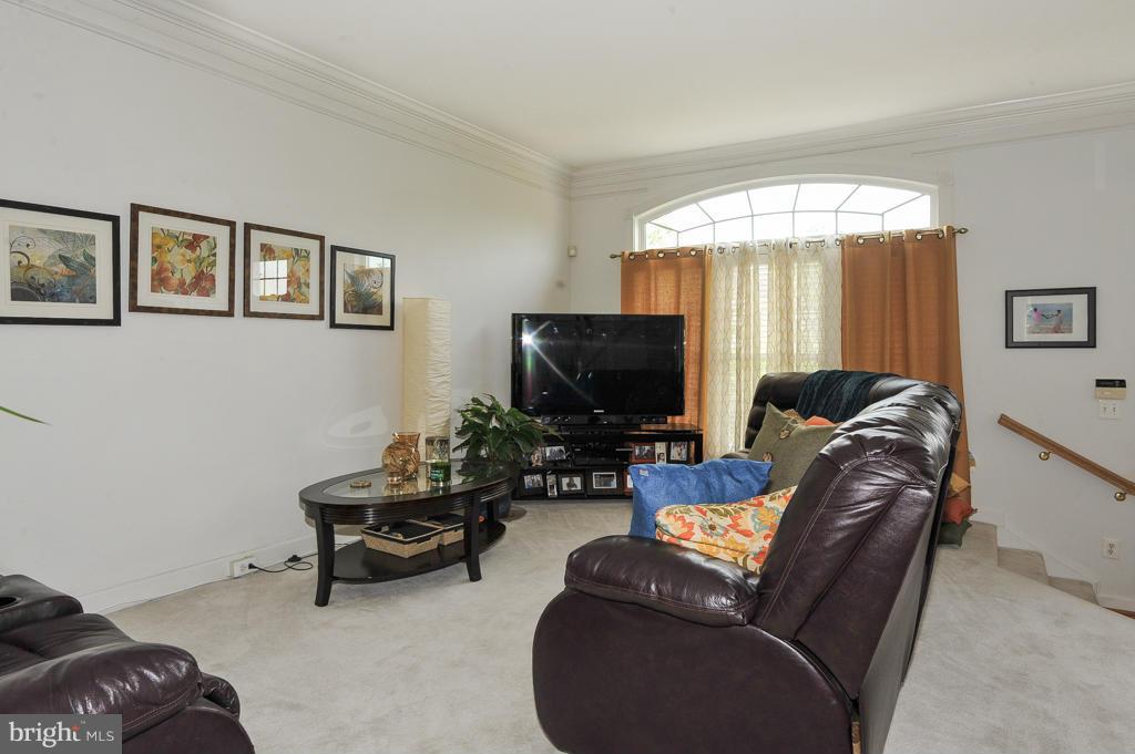6625 Debra Lu Way Springfield, VA 22150 - Photo 2 of 26 a living room with furniture and a flat screen tv
