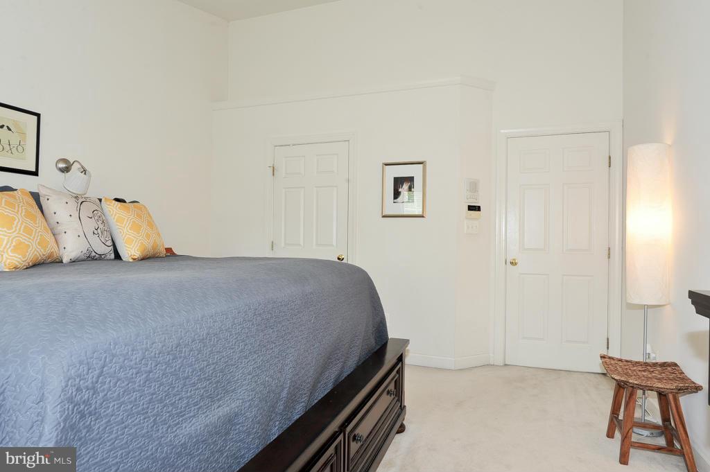 6625 Debra Lu Way Springfield, VA 22150 - Photo 13 of 26 a bedroom with a bed and a chair