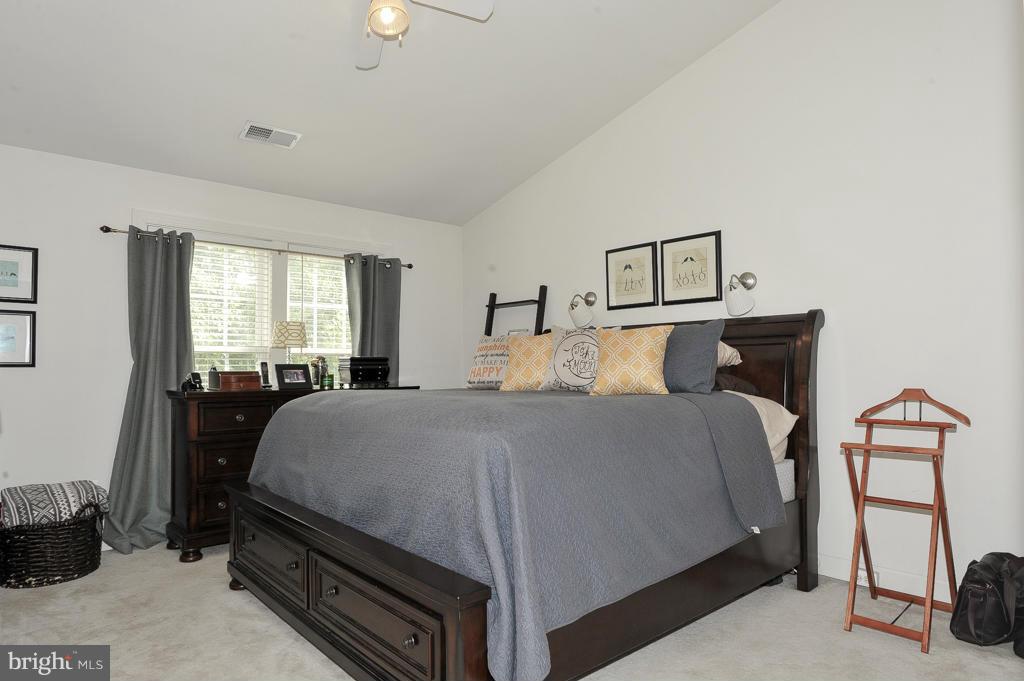 6625 Debra Lu Way Springfield, VA 22150 - Photo 14 of 26 a bedroom with a bed and window
