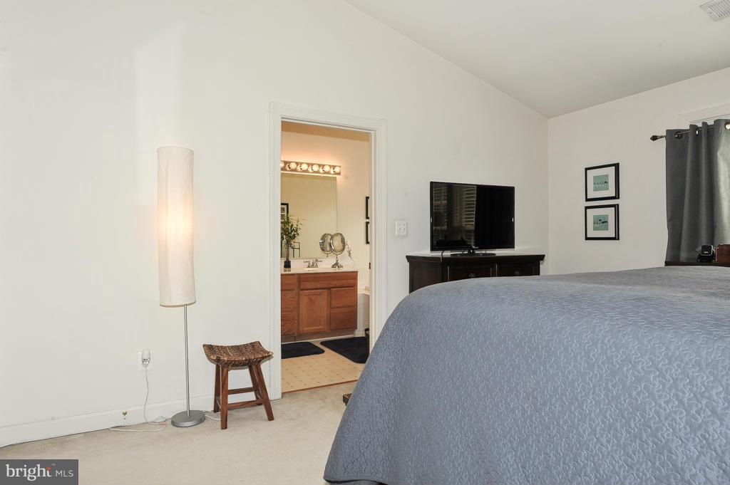 6625 Debra Lu Way Springfield, VA 22150 - Photo 15 of 26 a bedroom with a bed and furniture