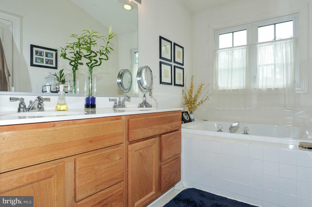 6625 Debra Lu Way Springfield, VA 22150 - Photo 17 of 26 a bathroom with a sink and a mirror