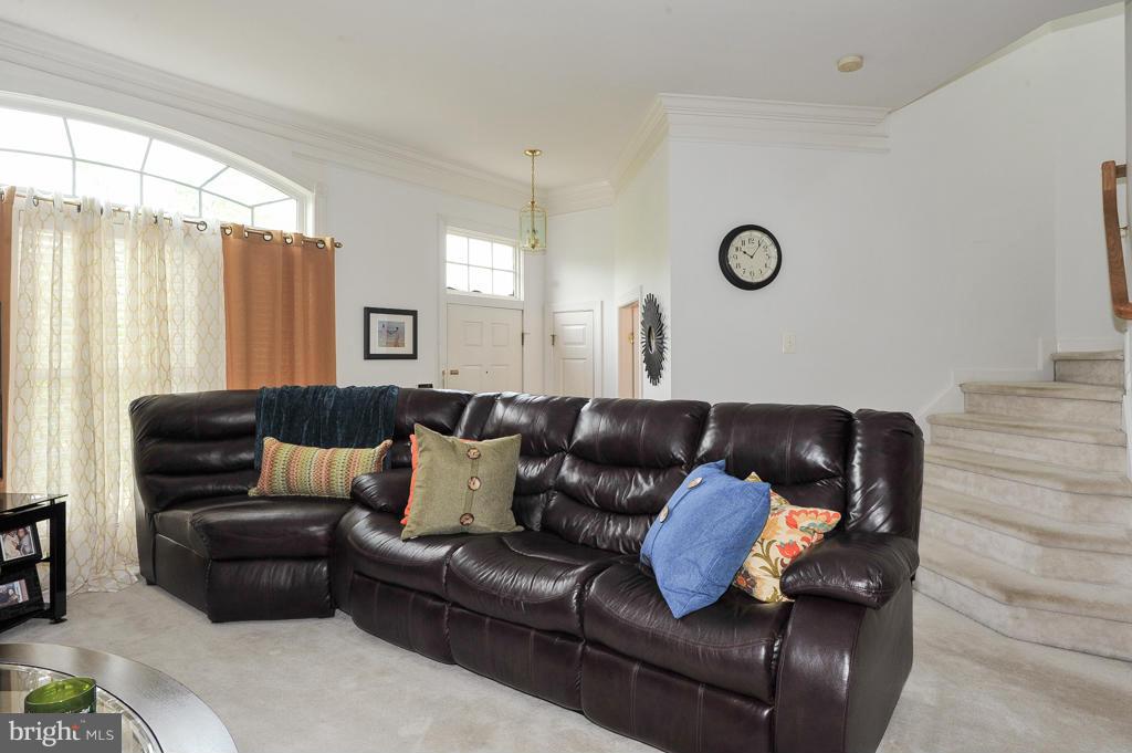 6625 Debra Lu Way Springfield, VA 22150 - Photo 3 of 26 a living room with furniture and a large window