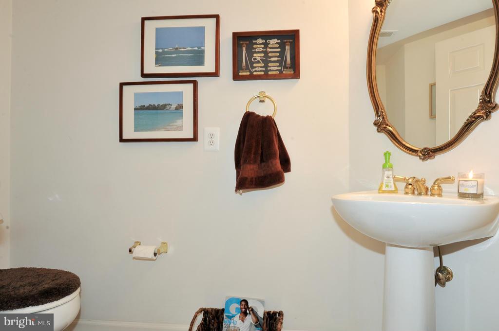 6625 Debra Lu Way Springfield, VA 22150 - Photo 24 of 26 a bathroom with a sink and a mirror