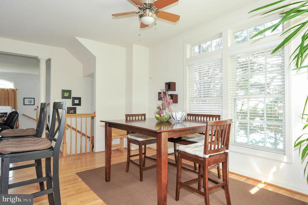6625 Debra Lu Way Springfield, VA 22150 - Photo 6 of 26 a view of a dining room with furniture window and wooden floor