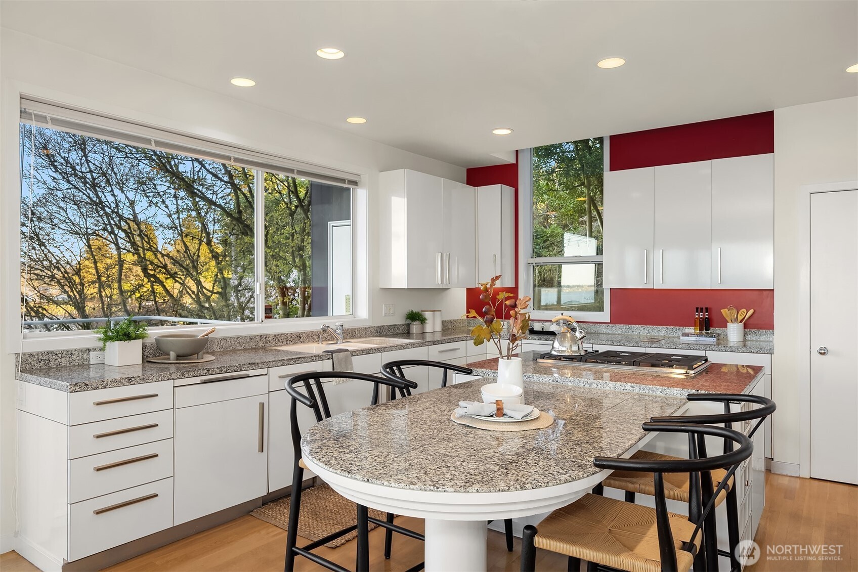 3903 48th Avenue South Seattle, WA 98118 - Photo 22 of 40 a kitchen with stainless steel appliances granite countertop a table and chairs