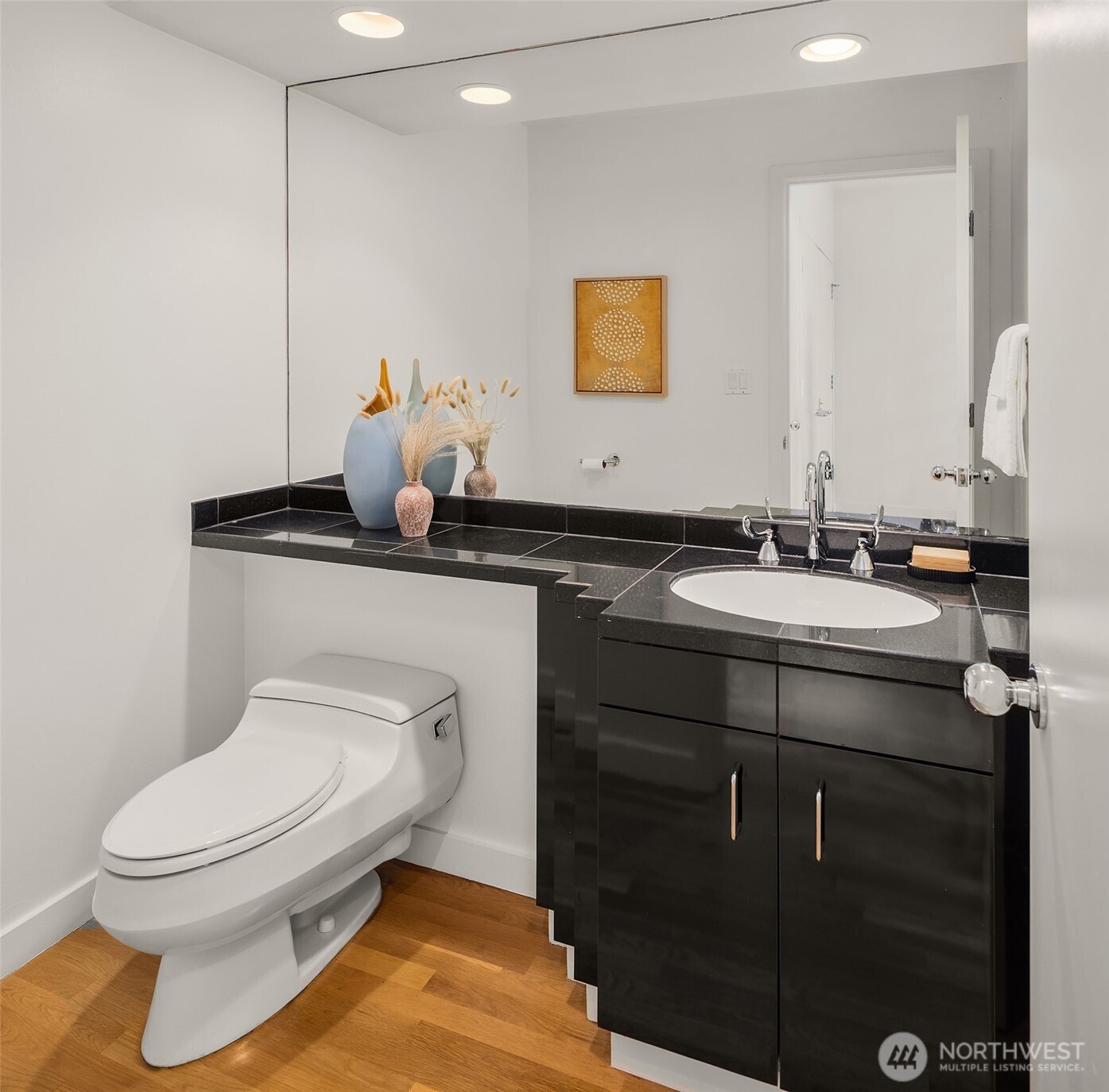 3903 48th Avenue South Seattle, WA 98118 - Photo 24 of 40 a bathroom with a toilet sink and mirror