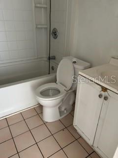 140 Minna Lane, Unit 214 Merritt Island, FL 32953 - Photo 5 of 6 a white toilet sitting next to a bath tub