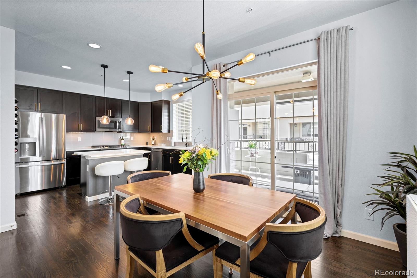 1124 Rockhurst Drive, Unit A Highlands Ranch, CO 80129 - Photo 13 of 45 a kitchen with a table and chairs