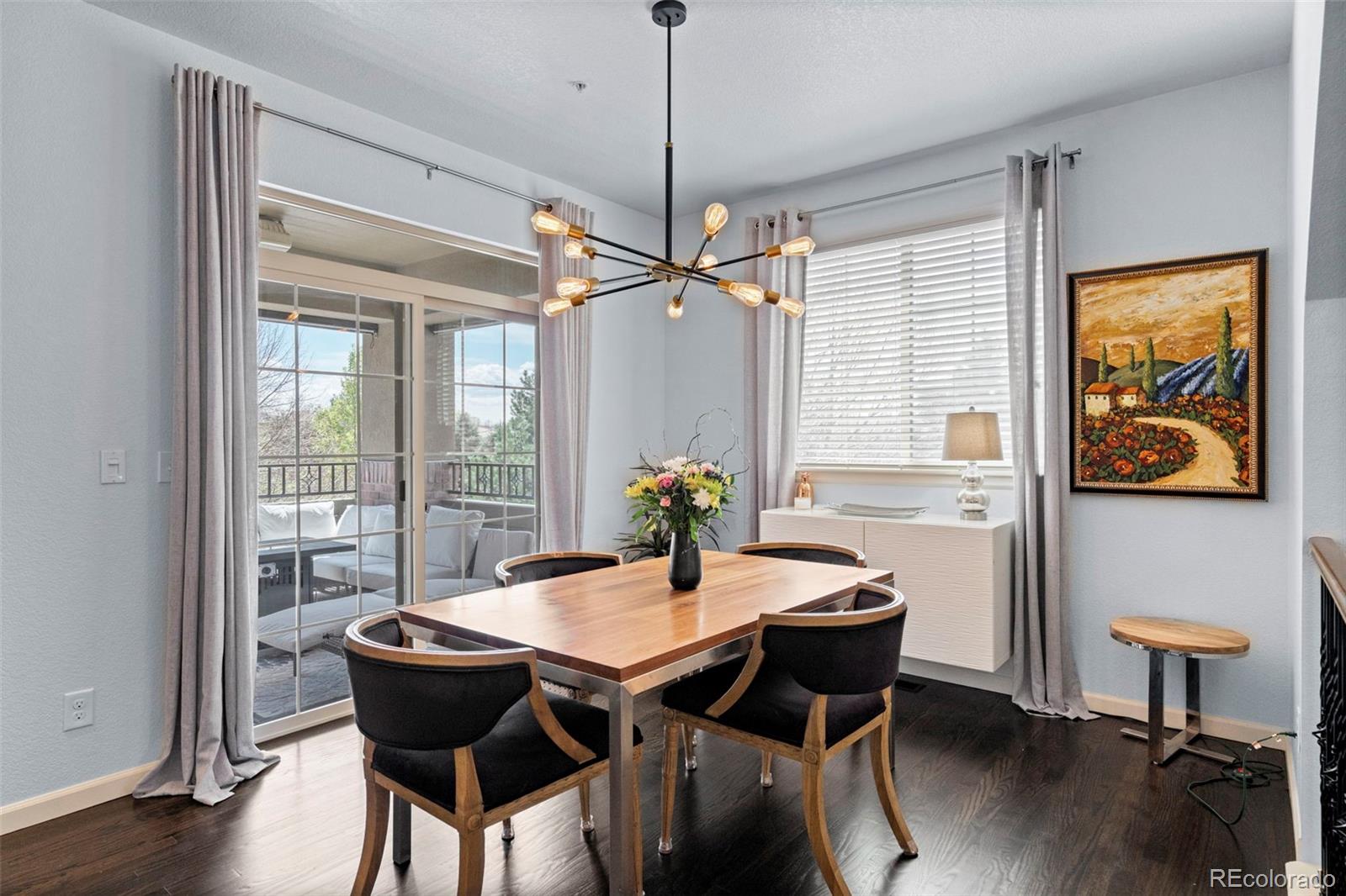 1124 Rockhurst Drive, Unit A Highlands Ranch, CO 80129 - Photo 15 of 45 a view of a dining room with furniture window and wooden floor