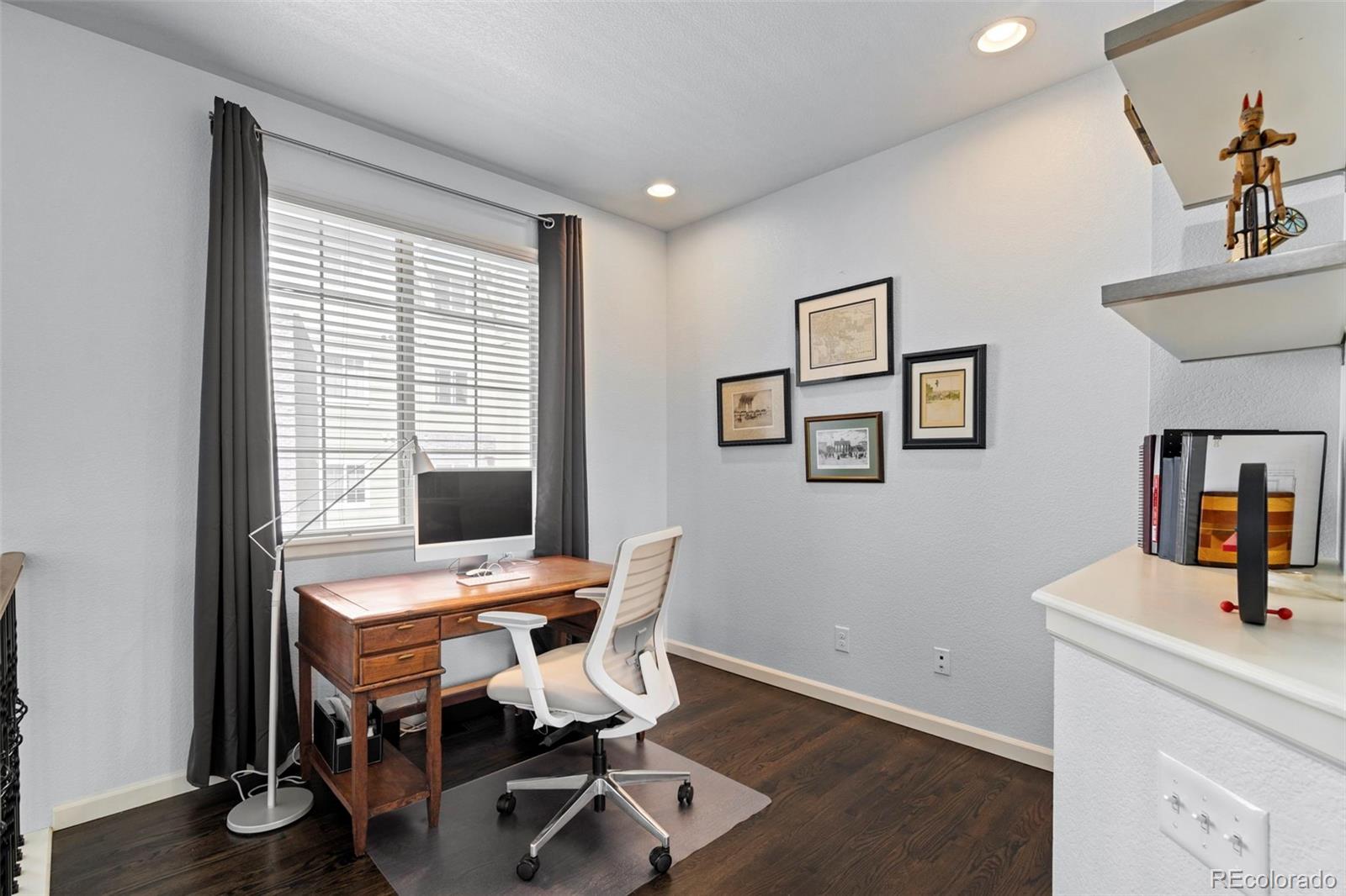 1124 Rockhurst Drive, Unit A Highlands Ranch, CO 80129 - Photo 18 of 45 a view of a workspace with furniture and a window