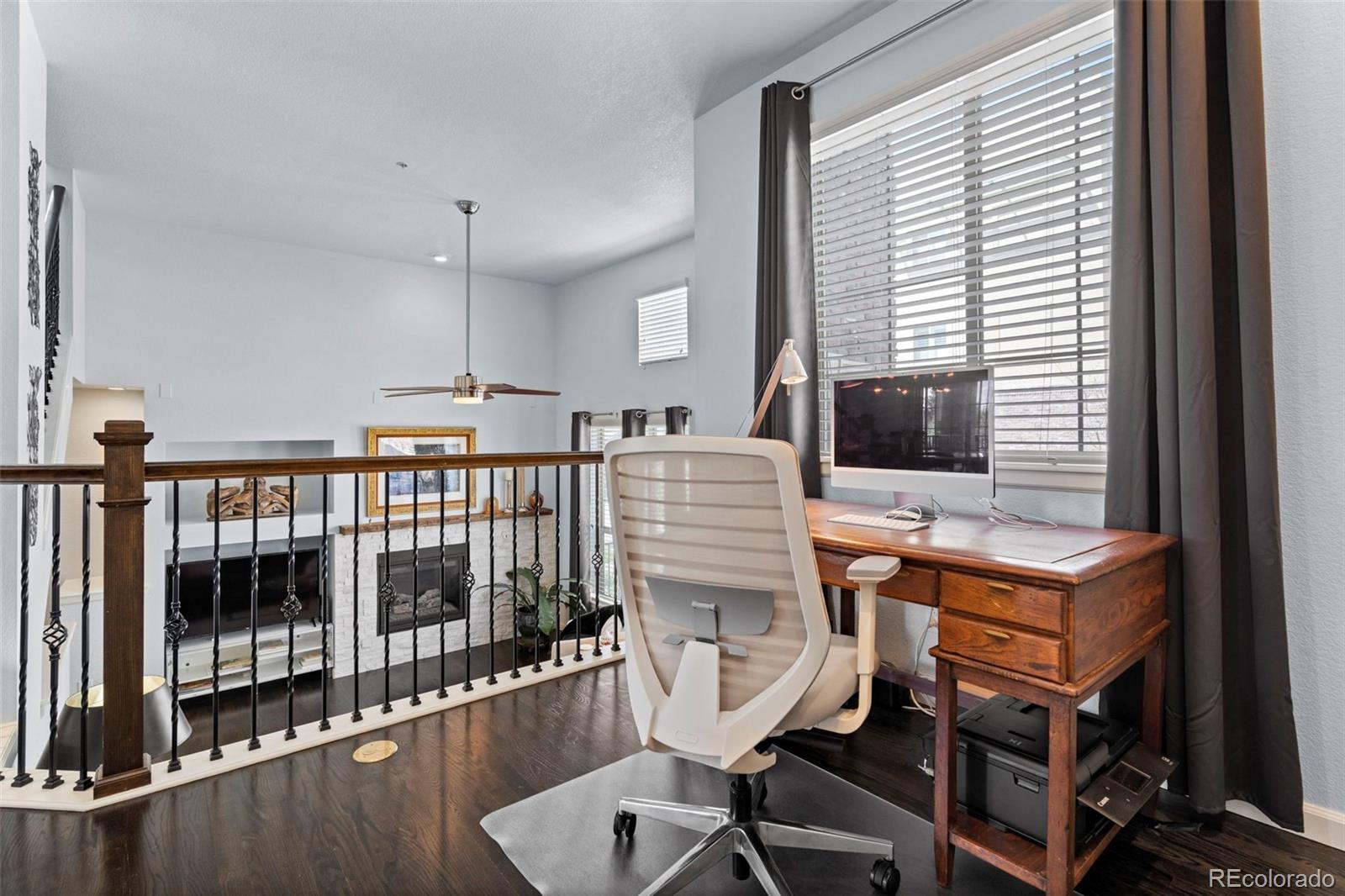 1124 Rockhurst Drive, Unit A Highlands Ranch, CO 80129 - Photo 19 of 45 a view of a workspace with furniture and a window