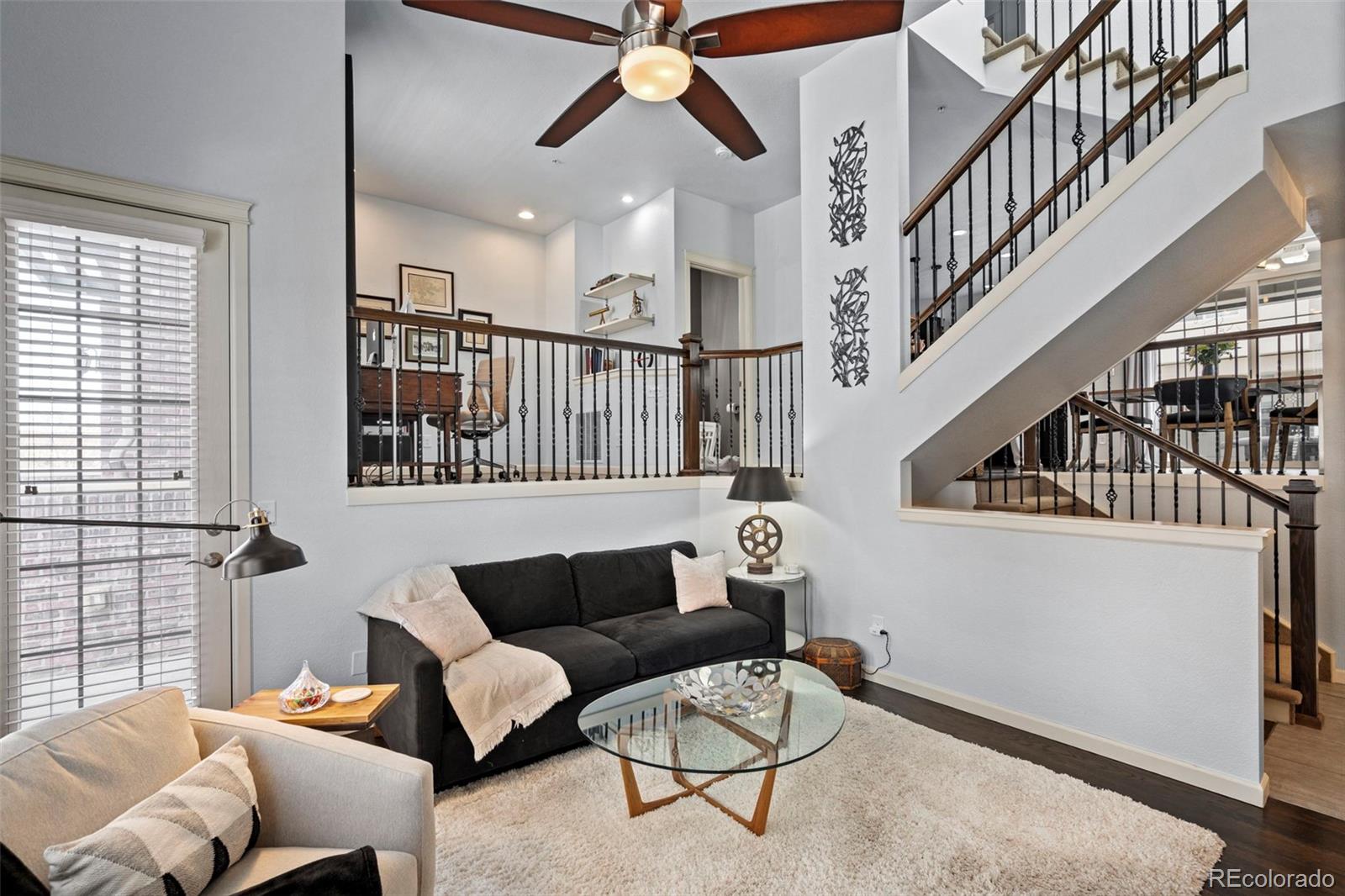1124 Rockhurst Drive, Unit A Highlands Ranch, CO 80129 - Photo 3 of 45 a living room with furniture and a ceiling fan