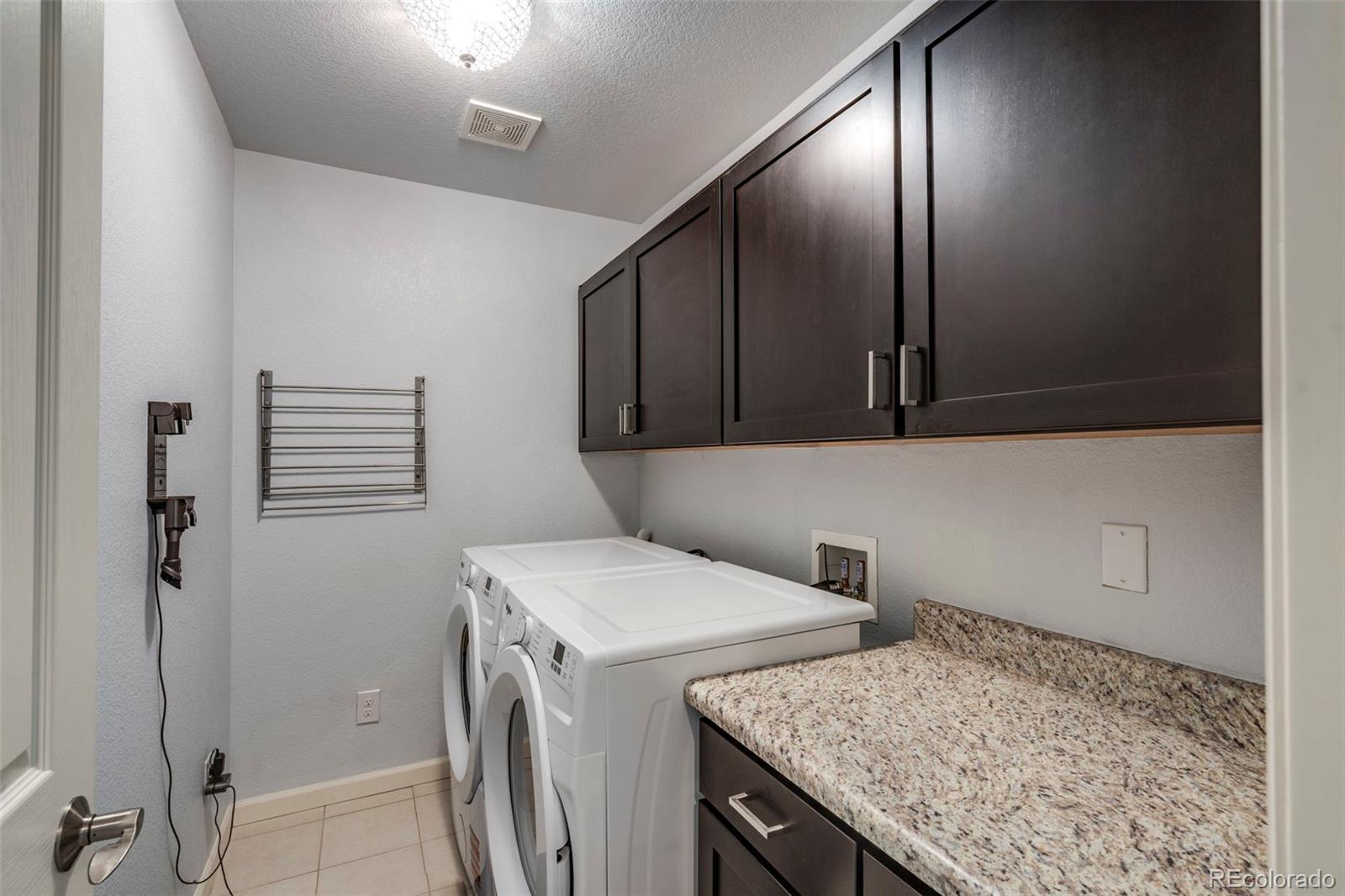 1124 Rockhurst Drive, Unit A Highlands Ranch, CO 80129 - Photo 33 of 45 a utility room with dryer and washer
