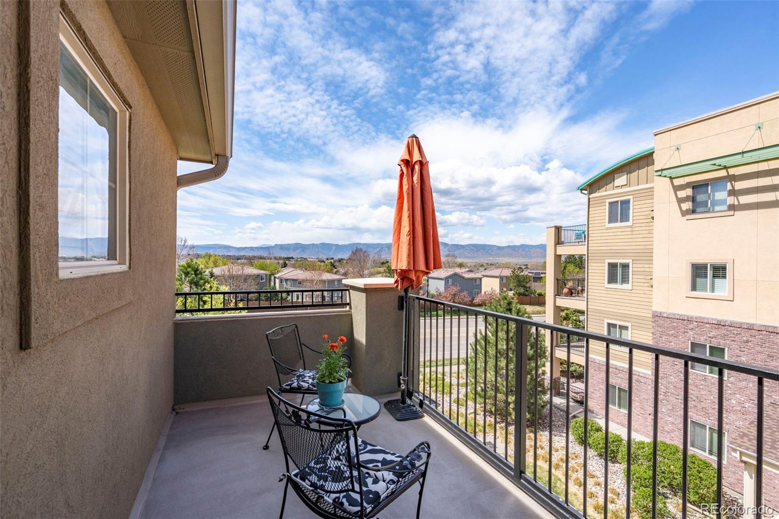 1124 Rockhurst Drive, Unit A Highlands Ranch, CO 80129 - Photo 34 of 45 a view of a chair and table in the balcony