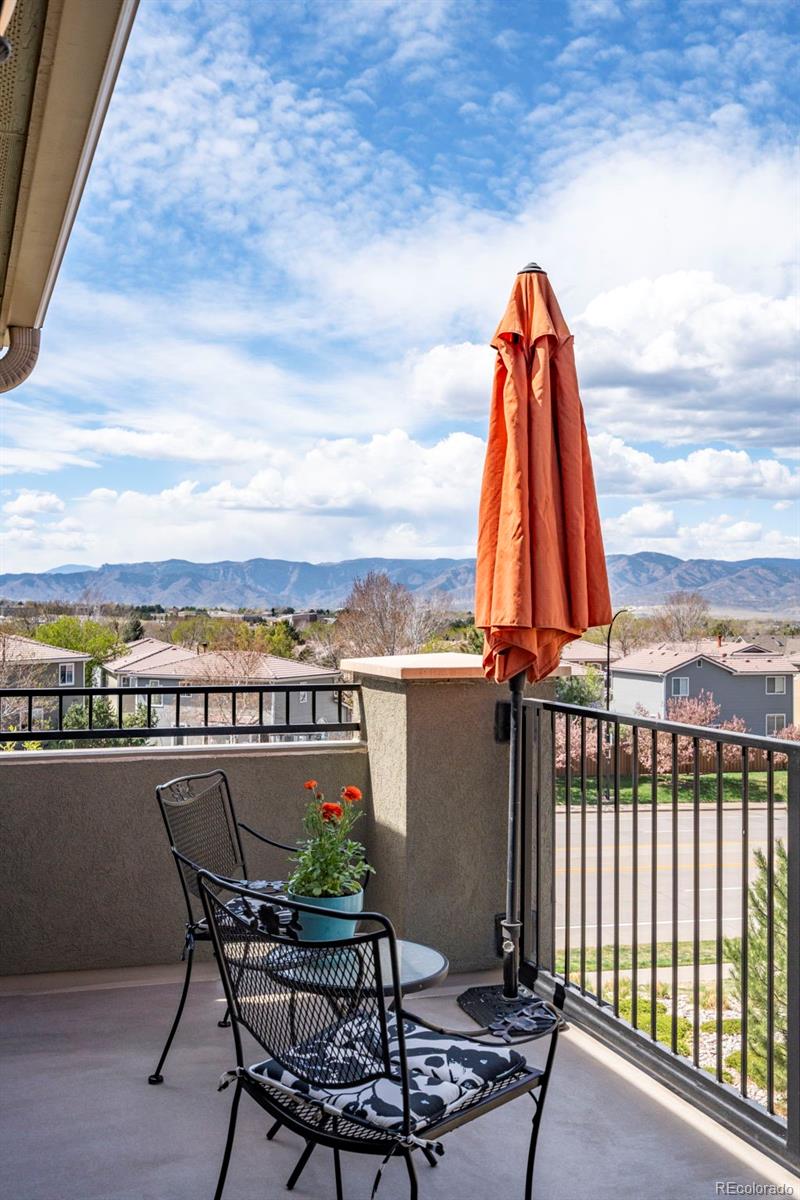 1124 Rockhurst Drive, Unit A Highlands Ranch, CO 80129 - Photo 35 of 45 a view of a lake with a deck and a patio