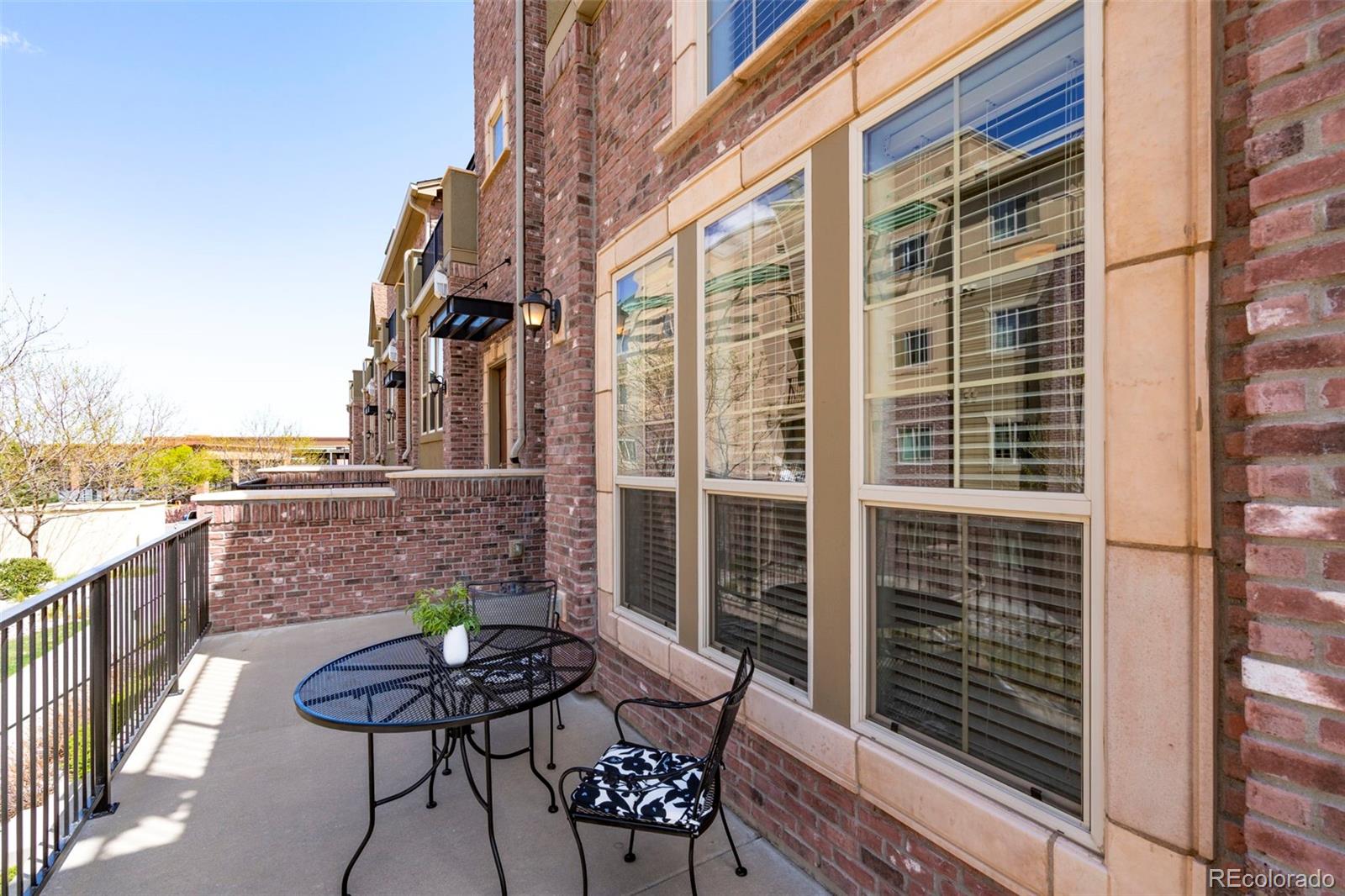 1124 Rockhurst Drive, Unit A Highlands Ranch, CO 80129 - Photo 38 of 45 a balcony with table and chairs