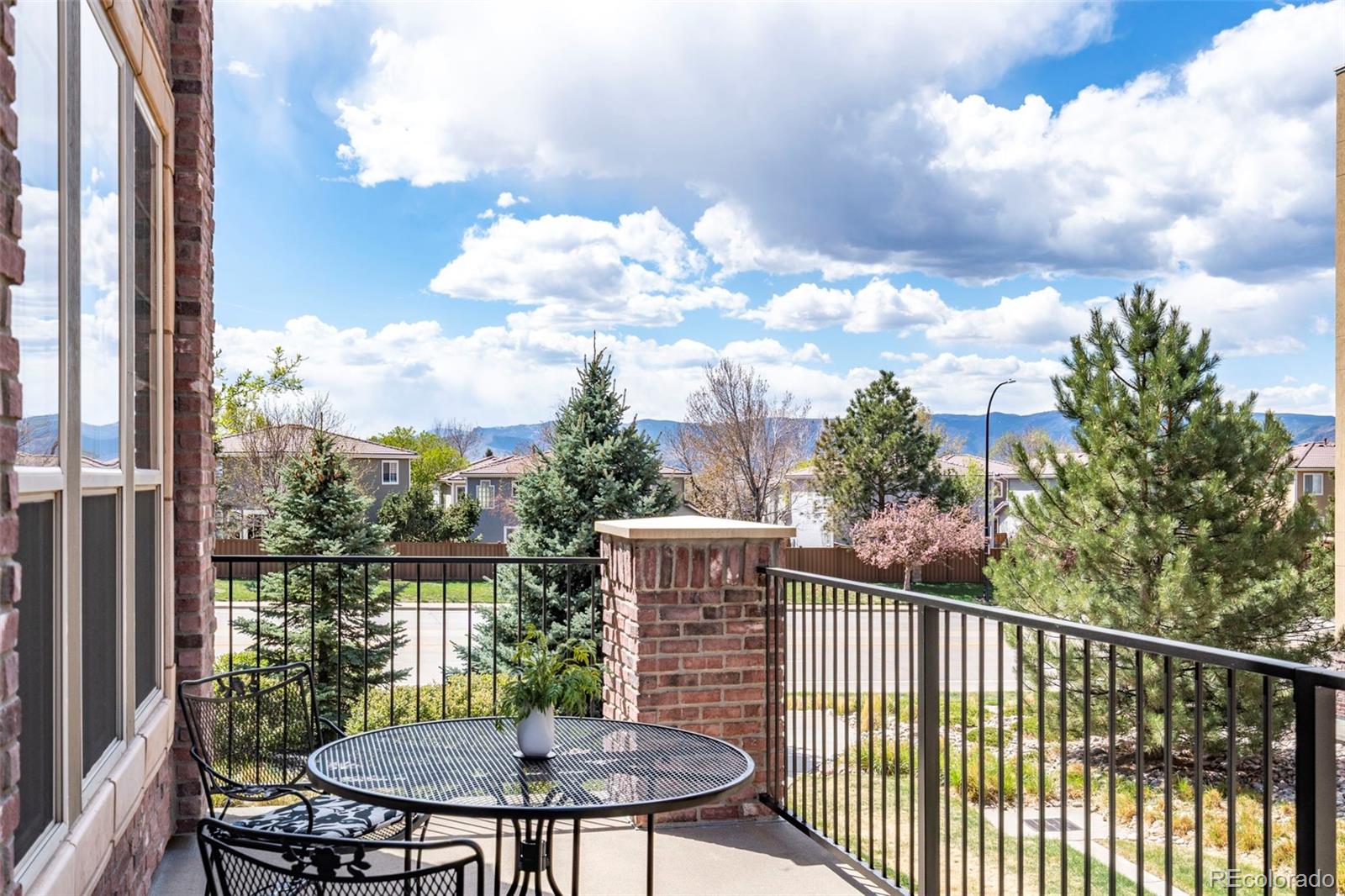 1124 Rockhurst Drive, Unit A Highlands Ranch, CO 80129 - Photo 39 of 45 a view of a balcony with a potted plant and wooden fence