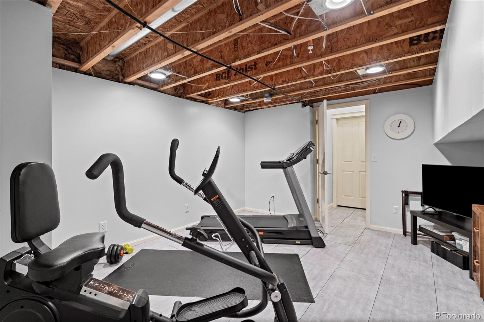 1124 Rockhurst Drive, Unit A Highlands Ranch, CO 80129 - Photo 40 of 45 a view of a room with gym equipment
