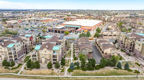 an aerial view of residential building and parking
