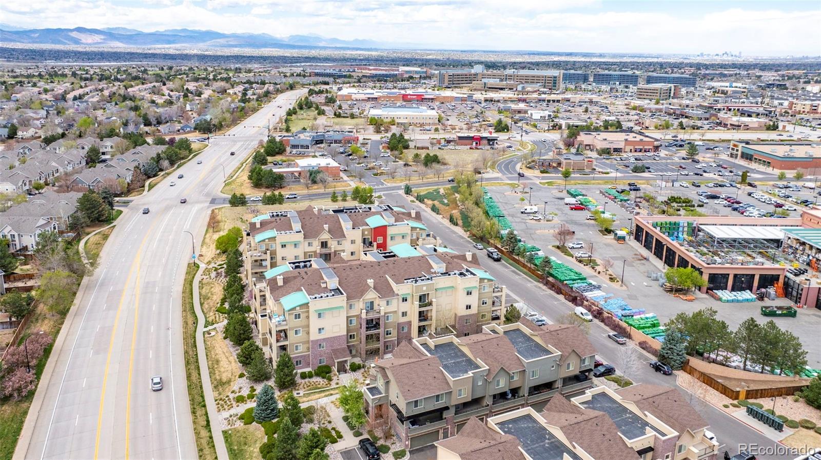 1124 Rockhurst Drive, Unit A Highlands Ranch, CO 80129 - Photo 43 of 45 an aerial view of residential building and parking space