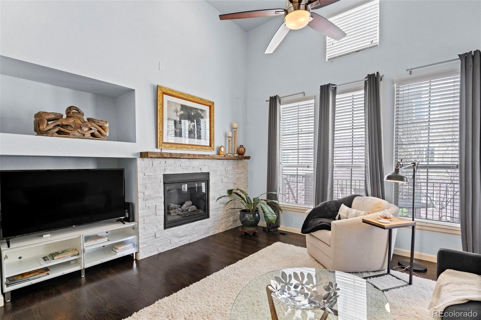 1124 Rockhurst Drive, Unit A Highlands Ranch, CO 80129 - Photo 5 of 45 a living room with furniture fireplace and window