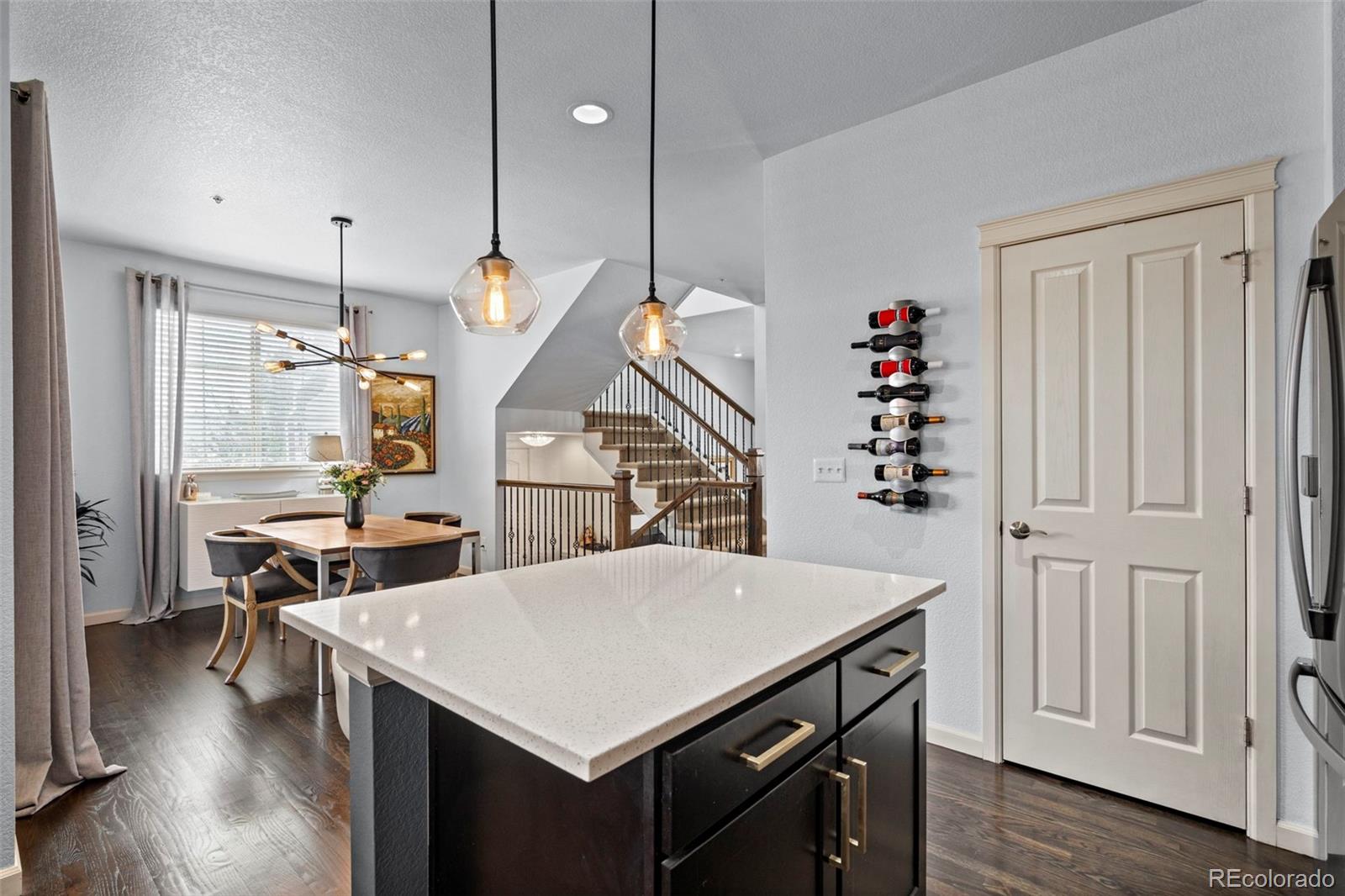 1124 Rockhurst Drive, Unit A Highlands Ranch, CO 80129 - Photo 9 of 45 a view of a dining room with furniture and wooden floor