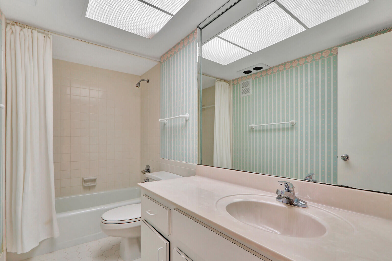 20 Celestial Way, Unit 214 Juno Beach, FL 33408 - Photo 15 of 33 a bathroom with a sink toilet and shower