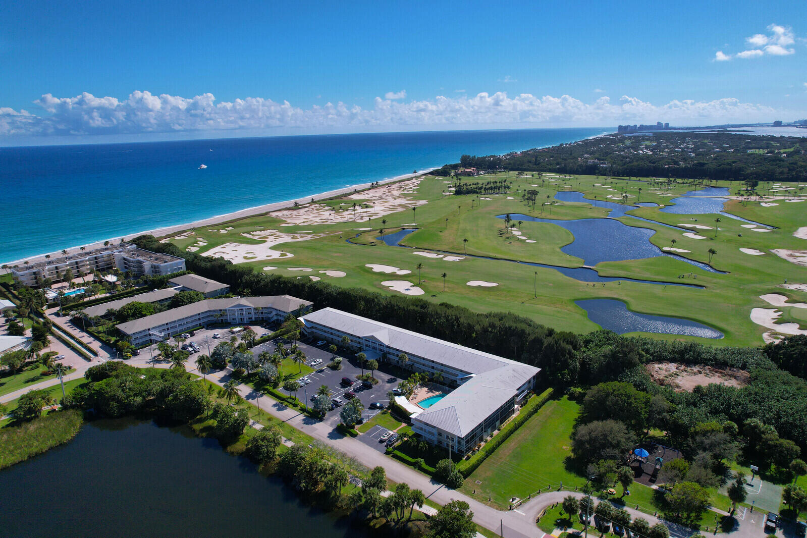 20 Celestial Way, Unit 214 Juno Beach, FL 33408 - Photo 20 of 33 an aerial view of a house with a lake view
