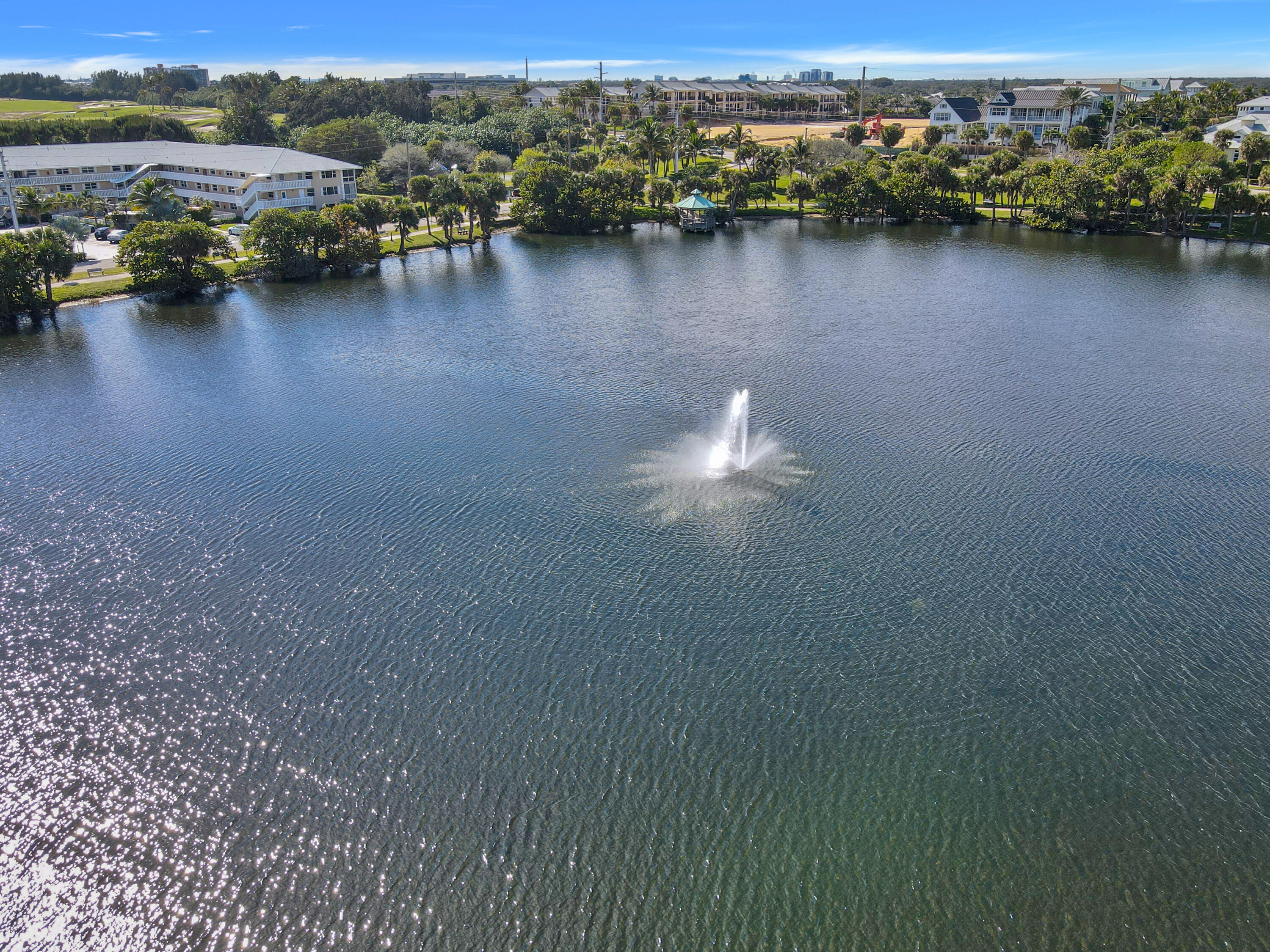 20 Celestial Way, Unit 214 Juno Beach, FL 33408 - Photo 24 of 33 a view of a lake with houses
