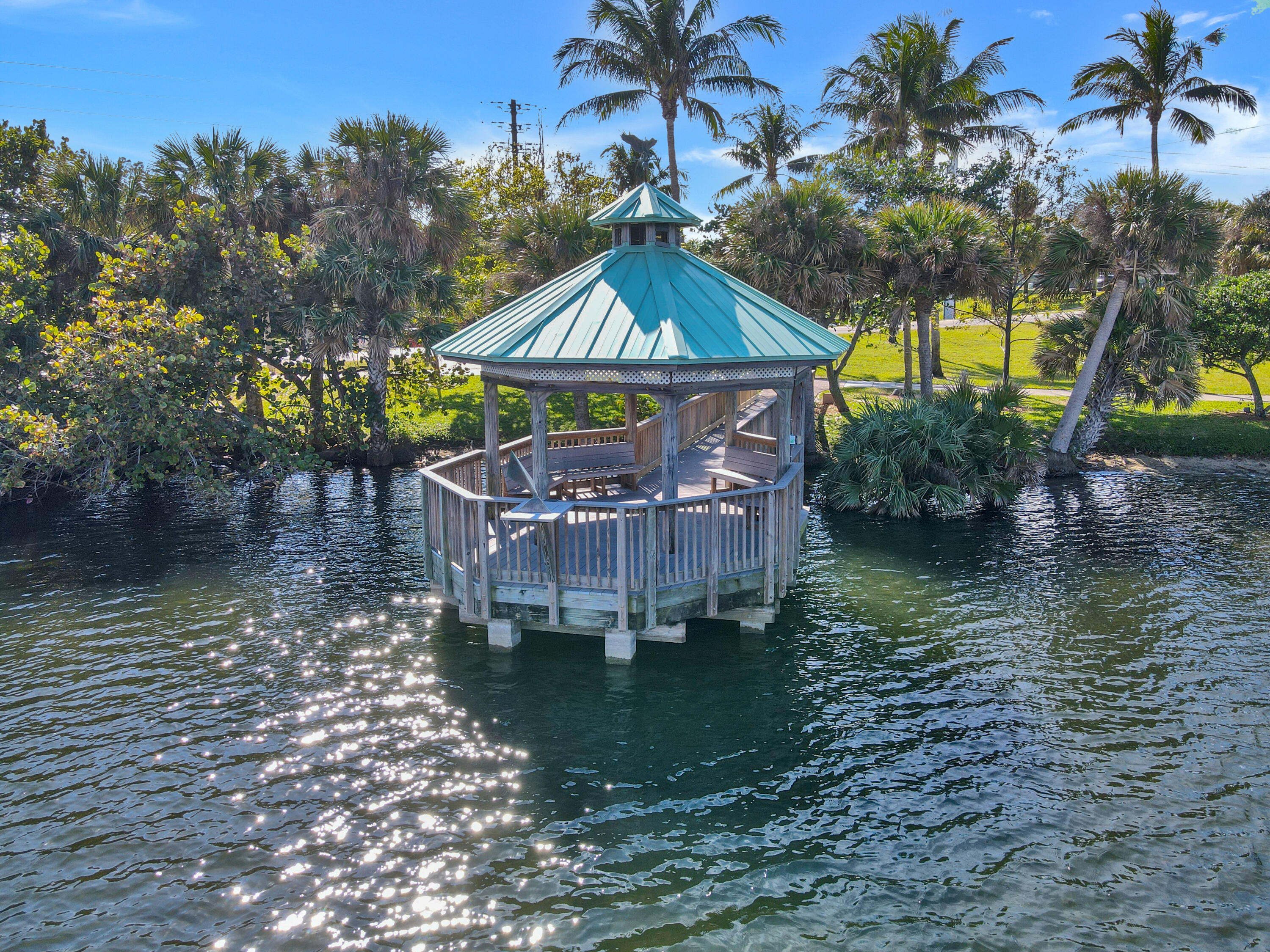 20 Celestial Way, Unit 214 Juno Beach, FL 33408 - Photo 25 of 33 a view of a house with a yard