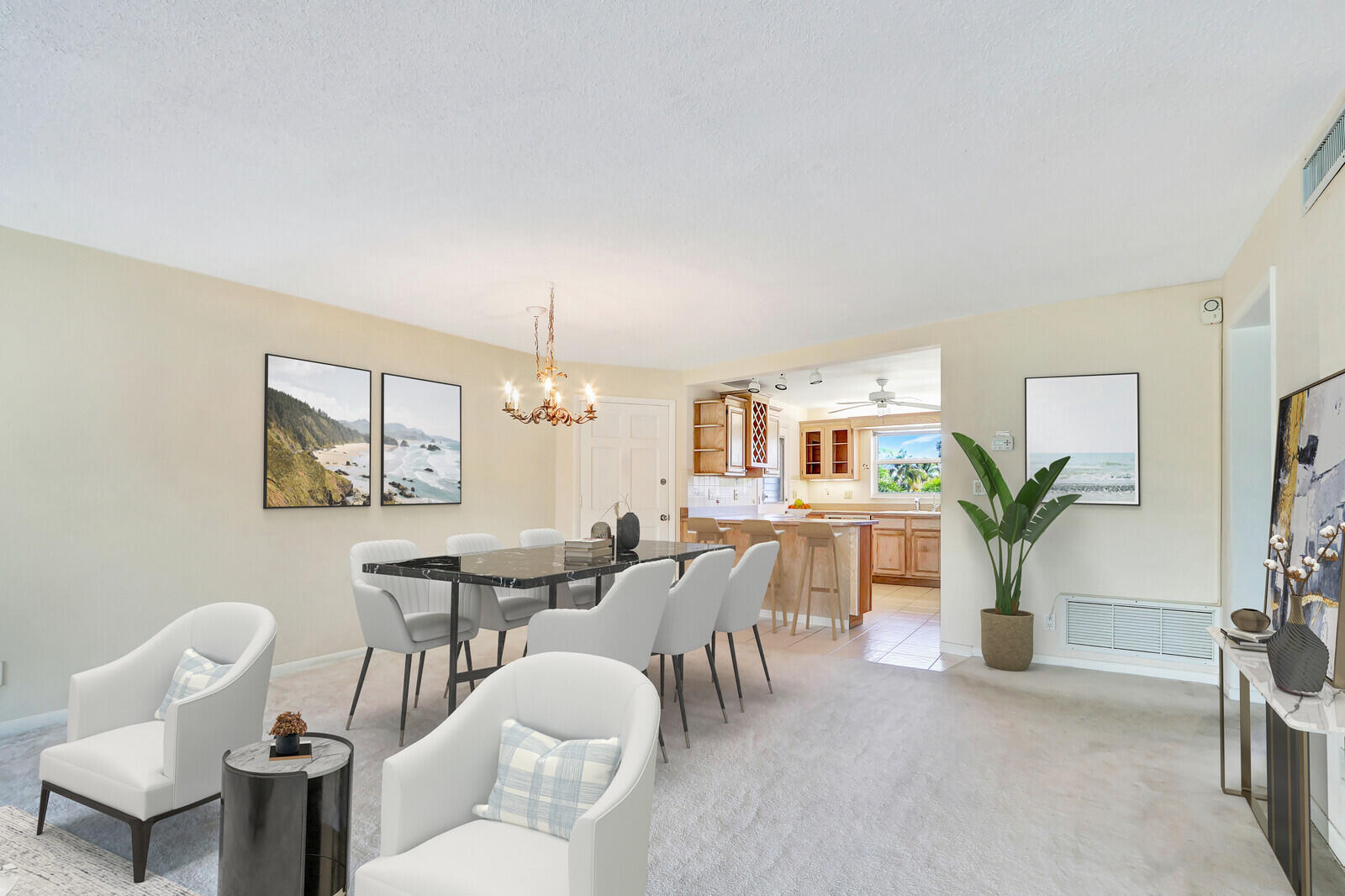 20 Celestial Way, Unit 214 Juno Beach, FL 33408 - Photo 5 of 33 a living room with furniture a chandelier and a potted plant