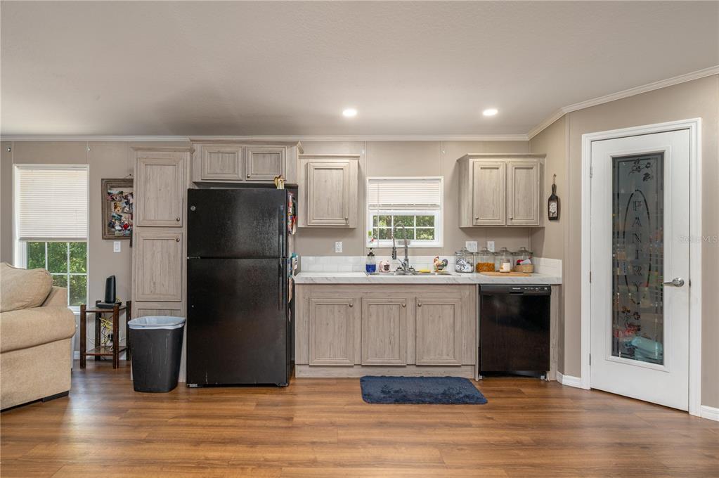 15079 Brahma Road Polk City, FL 33868 - Photo 16 of 40 a kitchen with a refrigerator and a sink
