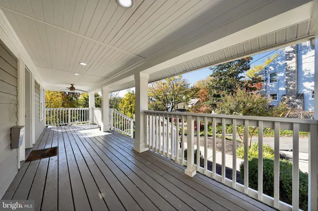 a view of a balcony with wooden floor