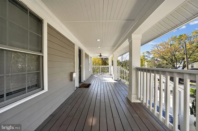 a view of balcony with wooden floor