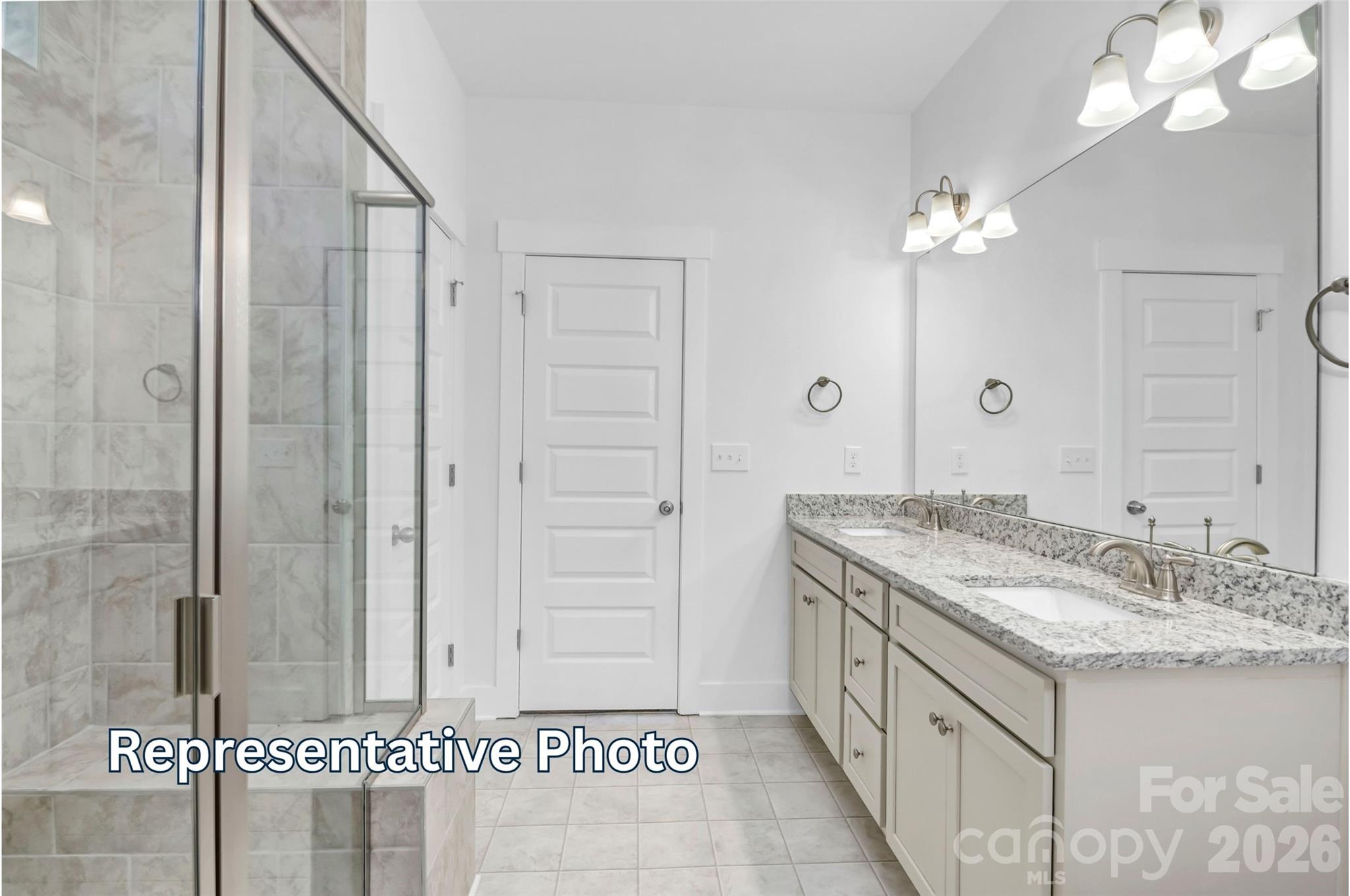 13122 Foxberry Road Charlotte, NC 28213 - Photo 11 of 20 a spacious bathroom with a granite countertop sink a mirror and shower