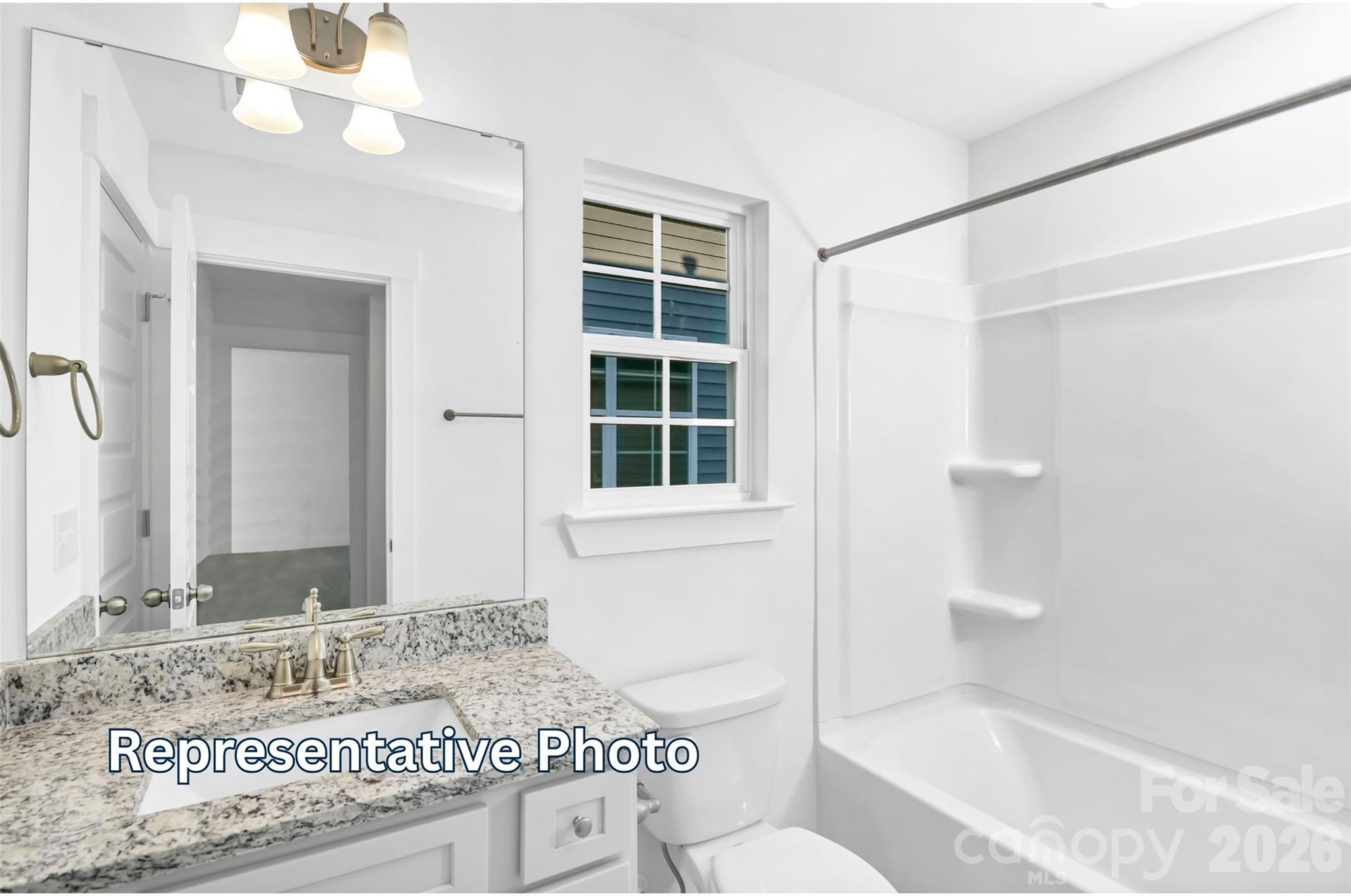 13122 Foxberry Road Charlotte, NC 28213 - Photo 18 of 20 a bathroom with a granite countertop sink a toilet and shower