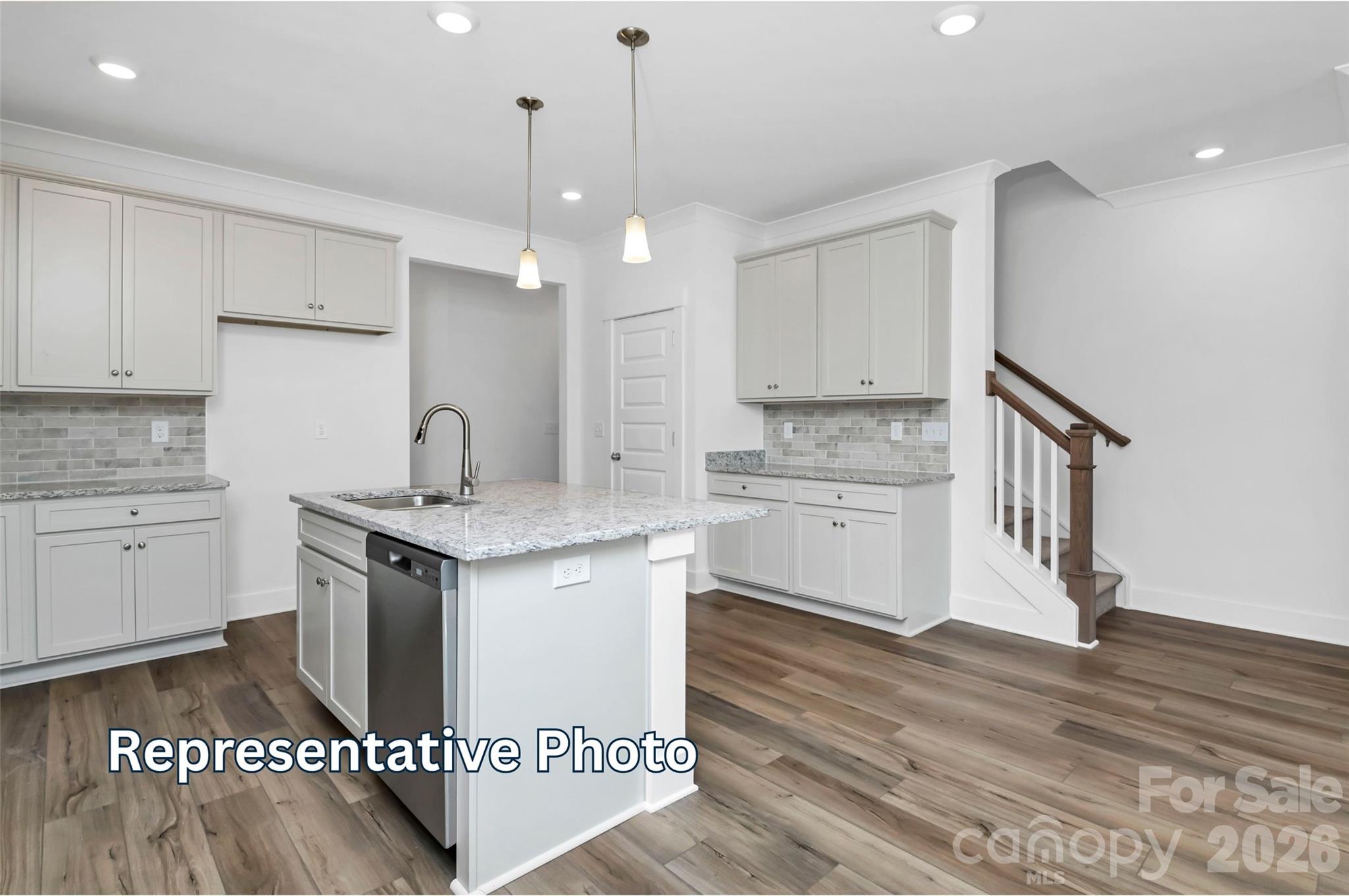 13122 Foxberry Road Charlotte, NC 28213 - Photo 6 of 20 a kitchen with stainless steel appliances granite countertop a stove a sink and a refrigerator