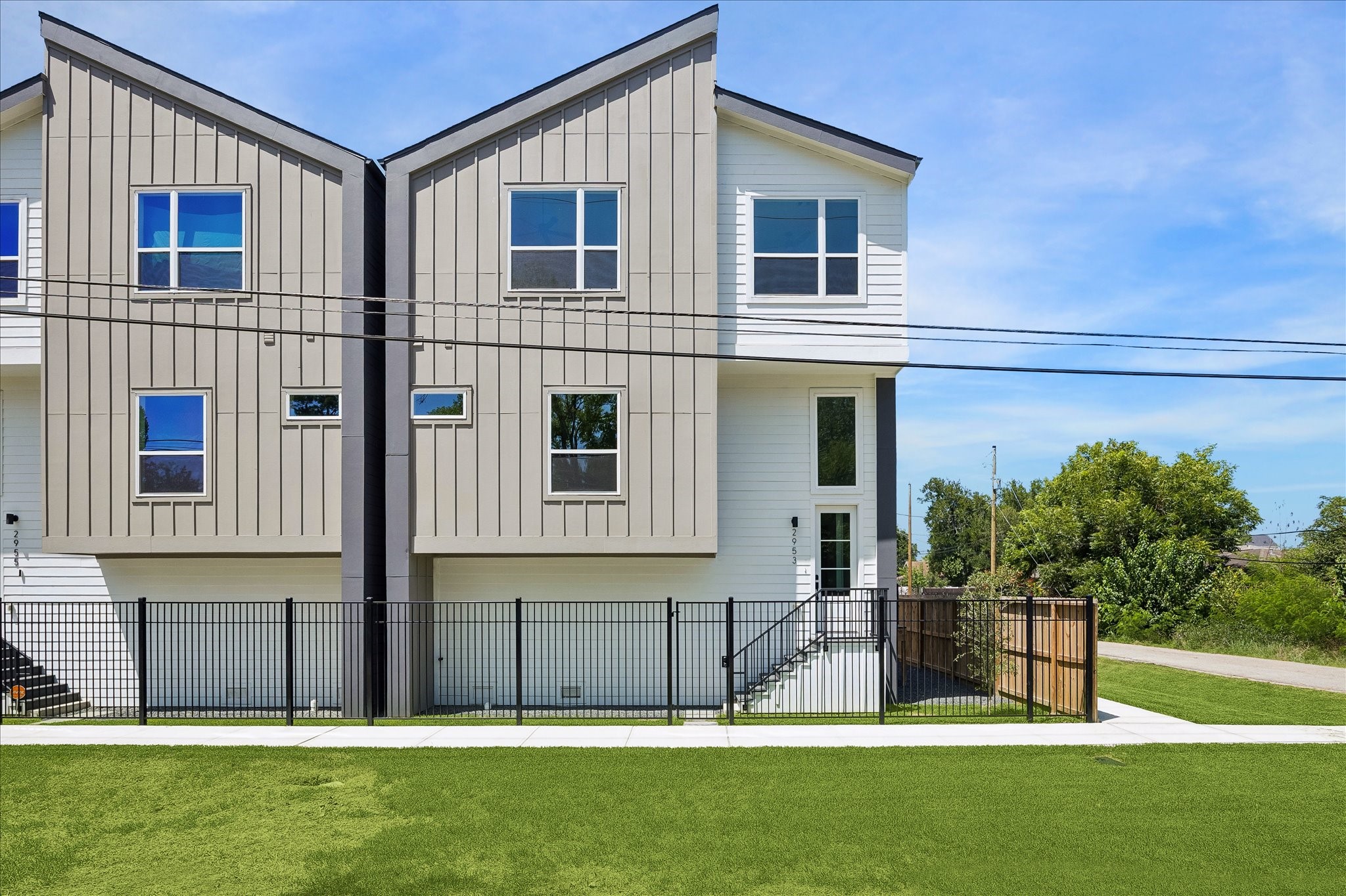 2953 Delafield Street Houston, TX 77023 - Photo 1 of 22 Modern architecture pairs clean lines with warm natural textures, creating striking curb appeal. Corner placement welcomes abundant natural light while the fully fenced front yard adds privacy and a true sense of arrival.