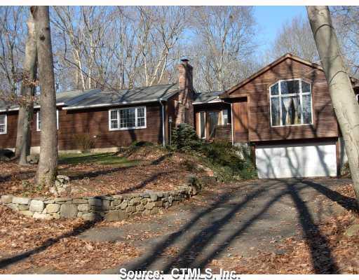 173 Old Toll Road Madison, CT 06443 - Photo 1 of 1 a front view of a house with a yard