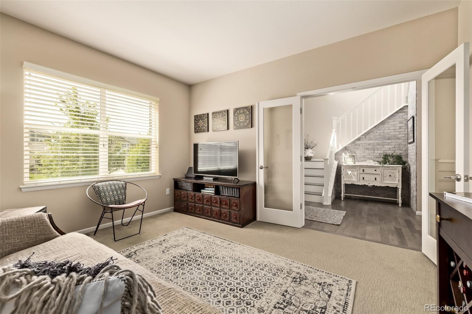 2289 Moss Place Erie, CO 80516 - Photo 13 of 45 a bedroom with a bed and furniture