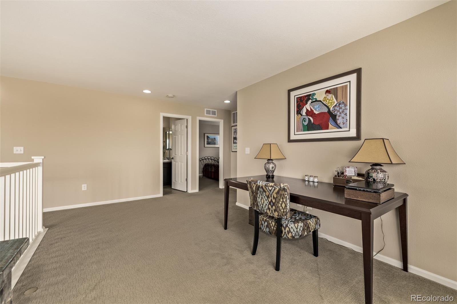 2289 Moss Place Erie, CO 80516 - Photo 18 of 45 a view of a livingroom with furniture and a couch
